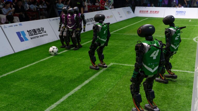 AI robots play football matches in China, show off skills, and take a few falls